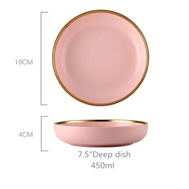 Gilt rim pink porcelain dinner plate from MC The Black Diamonds, featuring a ceramic design with food and cutlery set on table.