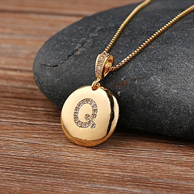 Nidin initial letter necklace featuring A-Z copper charm with CZ gemstones, jewelry by 𝕄𝕔 𝕋𝕙𝕖 𝔹𝕝𝕒𝕔𝕜 𝔻𝕚𝕒�