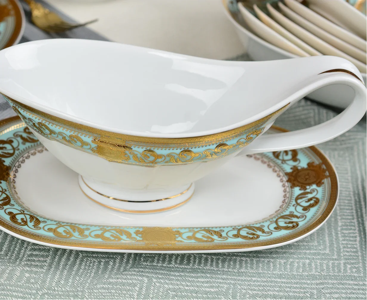 Elegant MC THE BLACK DIAMOND embossed gold porcelain dinnerware set featuring luxurious bone china with intricate patterns.