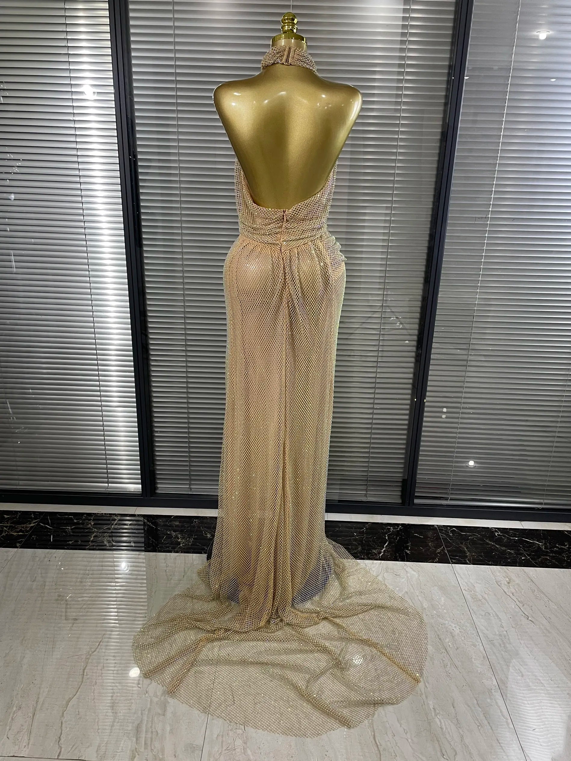 MC THE BLACK DIAMOND golden color women's dress featuring elegant design and flowing fabric, perfect for special occasions.