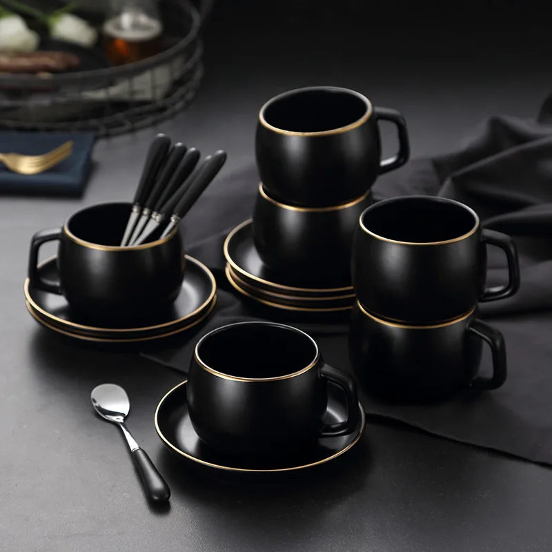 Creative matte black ceramic coffee cup with gold border and matching saucer, modern design for cafe or home decor.