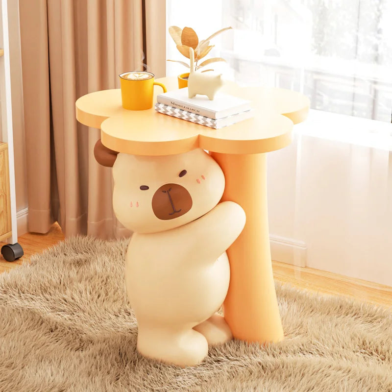 Animal figurines for home decor on a table by MC THE BLACK DIAMOND, showcasing detailed animal sculptures for stylish interior accents.