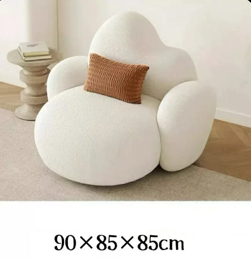 White MC THE BLACK DIAMOND sofa in a modern living room, featuring plush cushions and a comfortable lounge design.