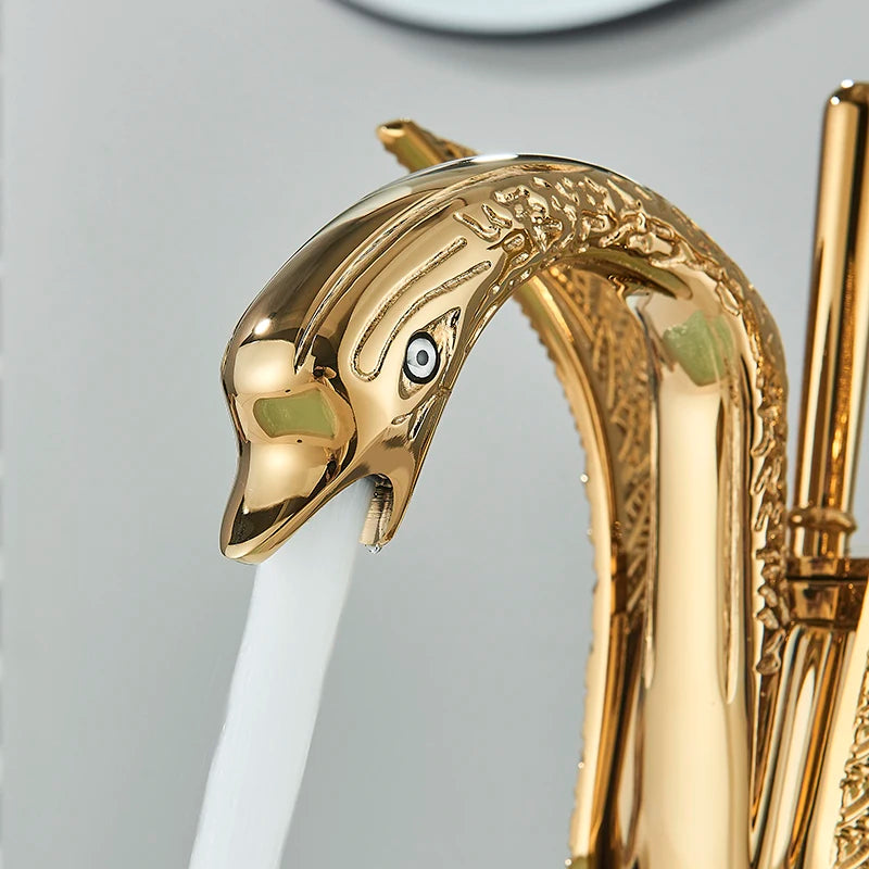MC THE BLACK DIAMOND golden basin faucet with swan shape, single handle deck mount sink mixer tap for hot and cold water.