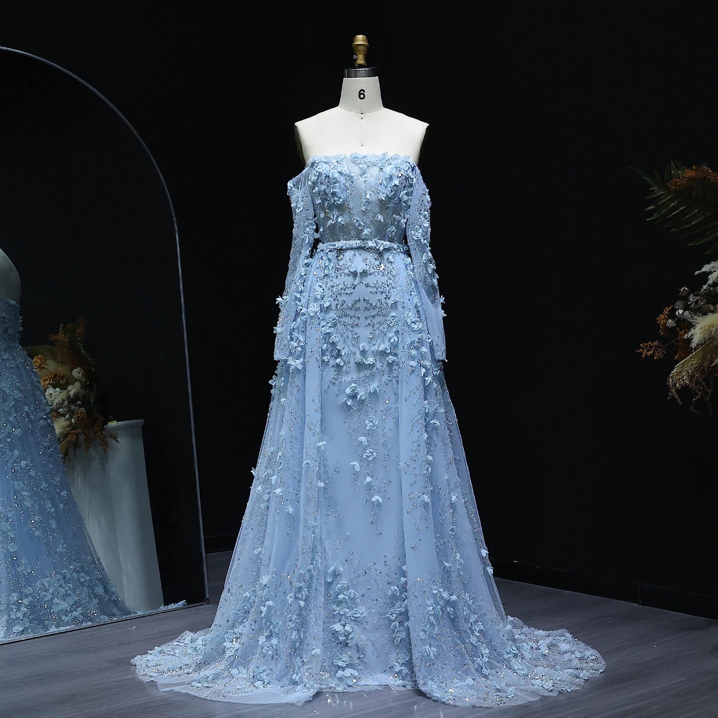 Elegant MC THE BLACK DIAMOND MC Elegant 3D Flowers Dubai evening dress with intricate floral embroidery and a flowing silhouette.