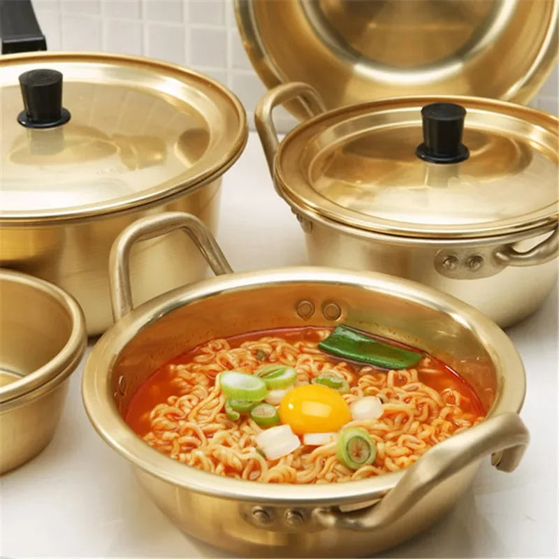 Korean style ramen noodles in a gold aluminum hot pot with oxidized coating, suitable for soup cooking, by MC THE BLACK DIAMOND.