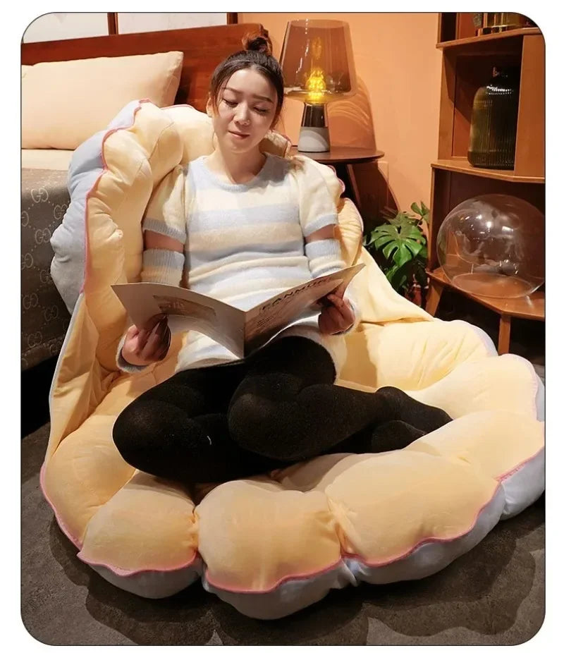 Large clamshell cushion plush pillow shaped like a seashell for kids' bed by MC The Black Diamond, perfect for a seashell-themed room.