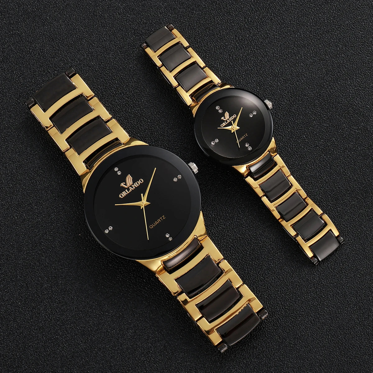 Pair of MC The Black Diamonds matching couple's watches with black dials, silver bands, and sleek design.