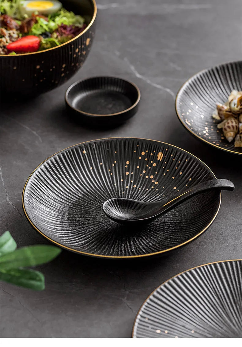 Set of black porcelain dinner plates with gilt rims from ๐๐ ๐๐๐ ๐น๐๐๐๐ ๐ป๐๐๐๐ ๏ฟฝ