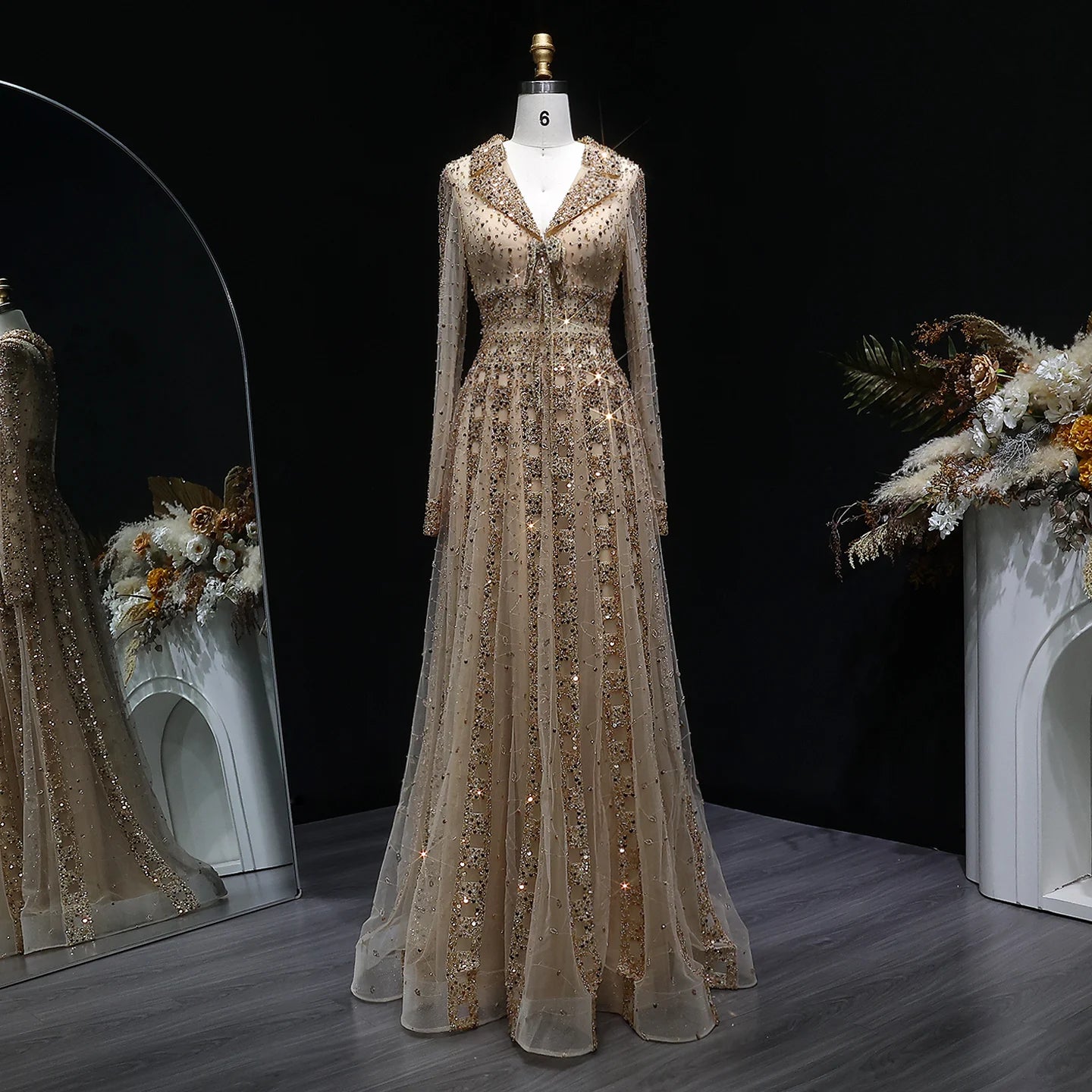 Elegant MC THE BLACK DIAMOND MC brand long sleeve formal evening dress with a sleek silhouette and intricate detailing.