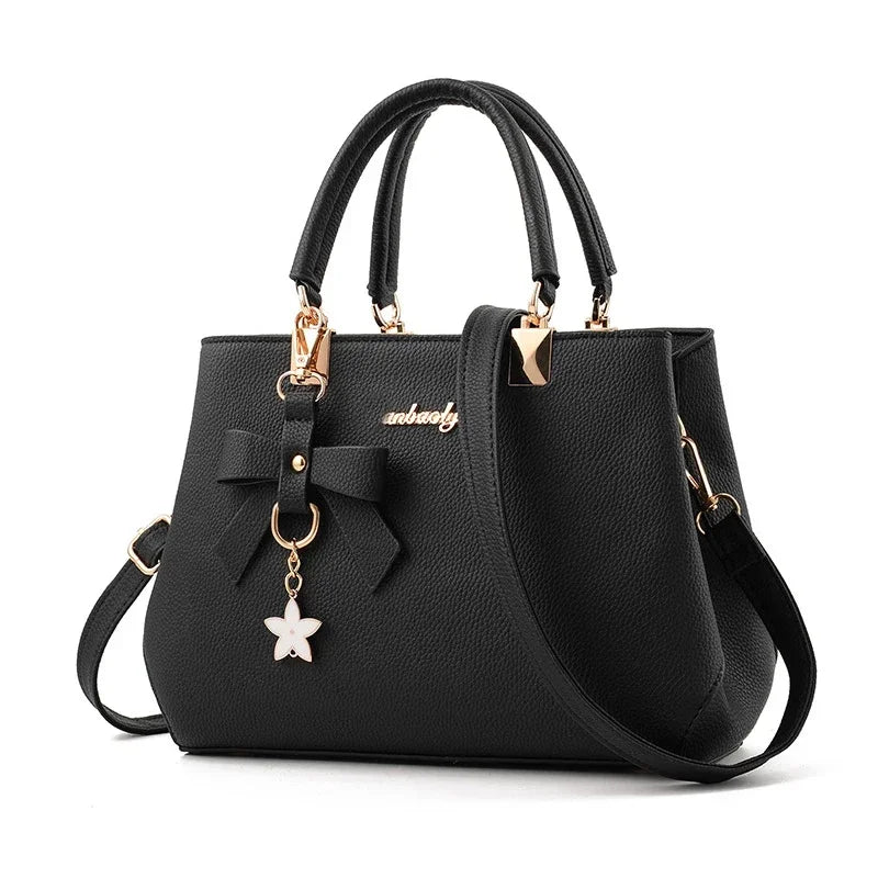 Women messenger bag with flower pendant from 𝕄𝕔 𝕋𝕙𝕖 𝔹𝕝𝕒𝕔𝕜 𝔻𝕚𝕒𝕞𝕠𝕟�