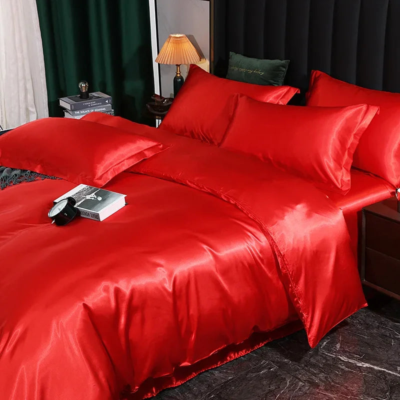 Luxury silk bedding set with duvet cover, fitted sheet, flat sheet, and pillowcases in solid color, king and queen sizes.