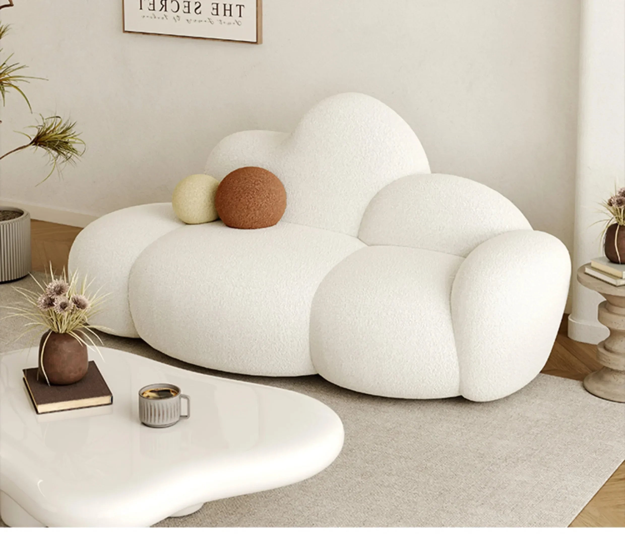 White MC THE BLACK DIAMOND sofa in a living room setting, featuring plush cushions and a comfortable lounge design.
