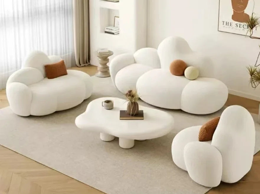 White MC THE BLACK DIAMOND sofa in a living room, featuring plush cushions and a comfortable lounge design.