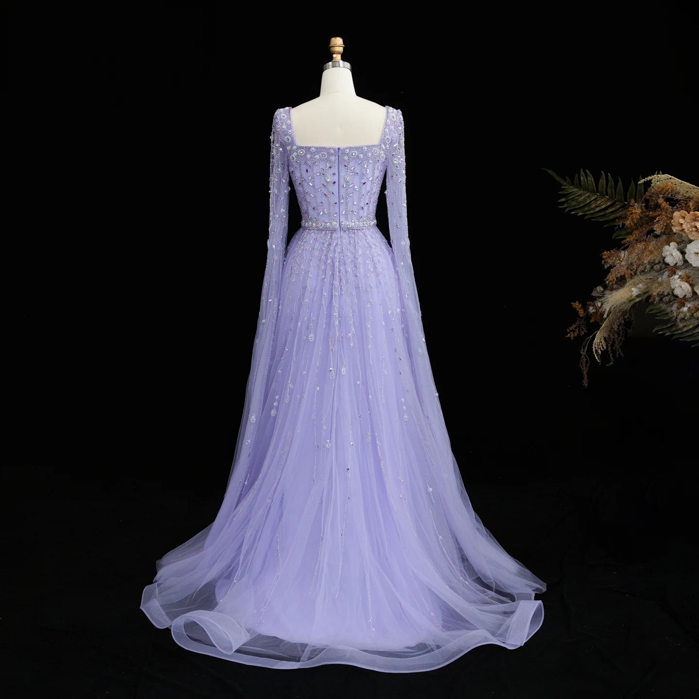Elegant pink Dubai evening dress by MC THE BLACK DIAMOND featuring intricate details and a flowing silhouette.