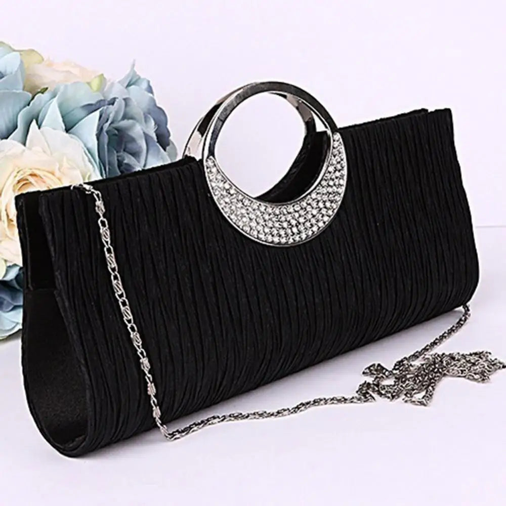 Luxury women's satin and rhinestone evening clutch bag with pleated design, perfect for parties and formal events.