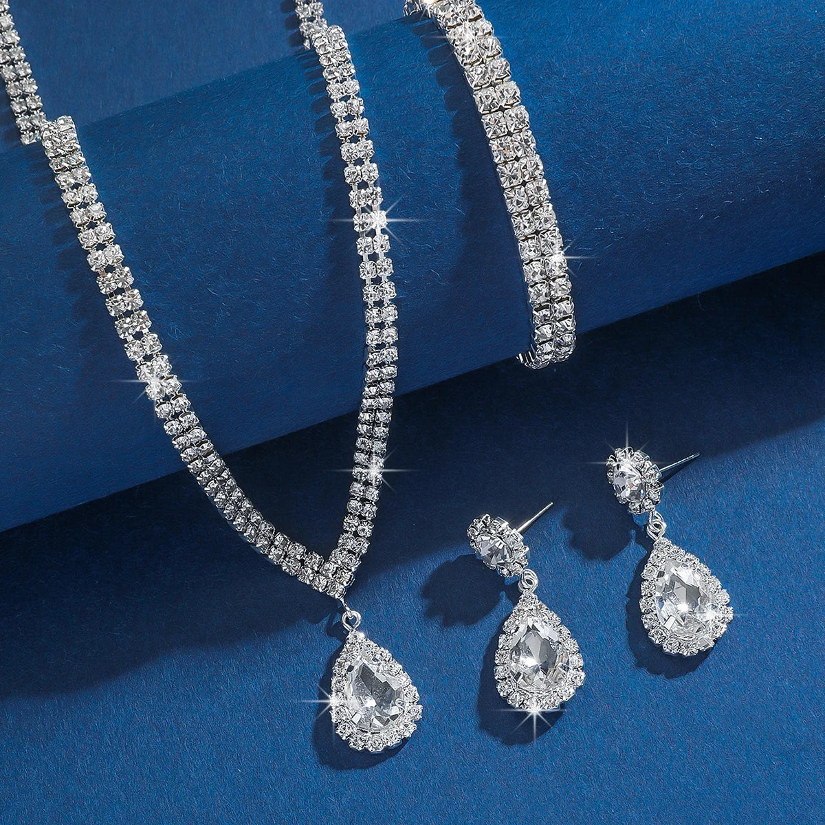 Wedding Season women's jewelry set with copper claw chain water drop necklace, earrings, and bracelet for wedding and festival occasions.