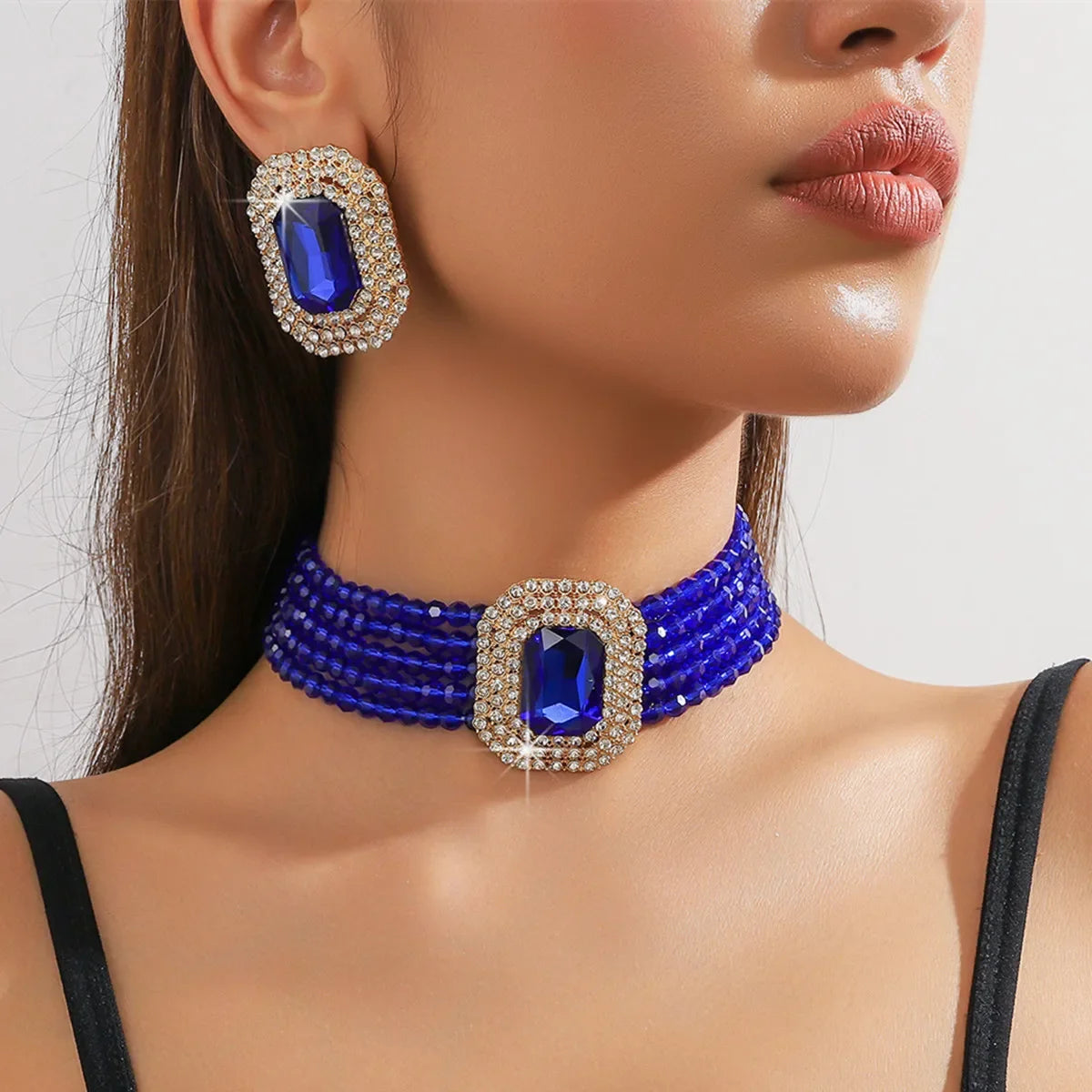MC THE BLACK DIAMOND multilayer crystal jewelry set with geometric square earrings in champagne, red, white, and black for women.