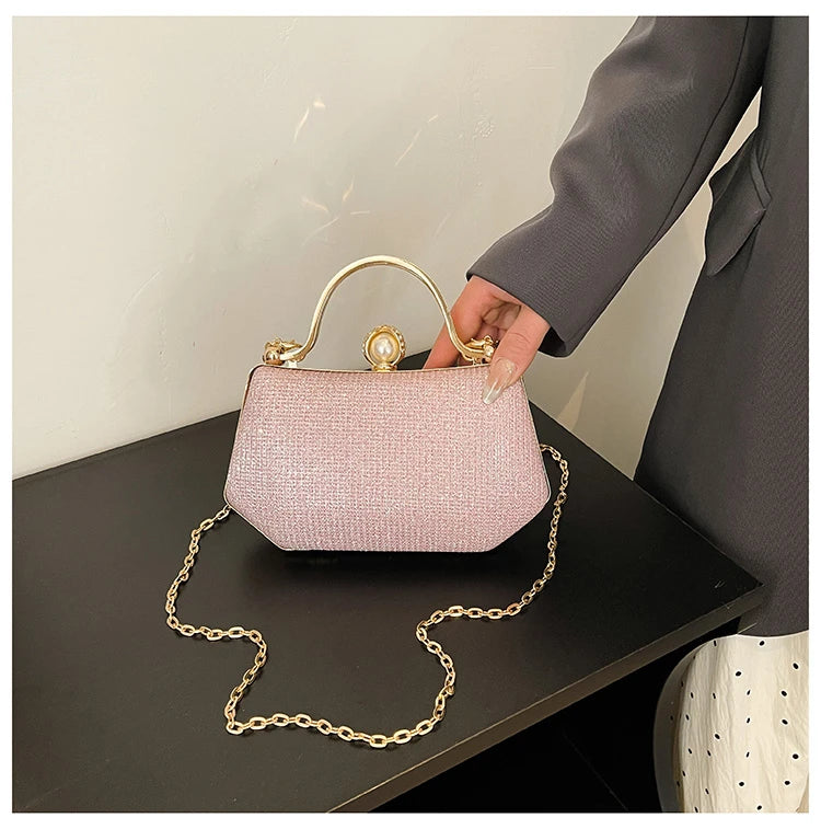 Black solid color MC The Black Diamonds womenโs hand bag with chain strap and simple crossbody style, featuring hasp closure.