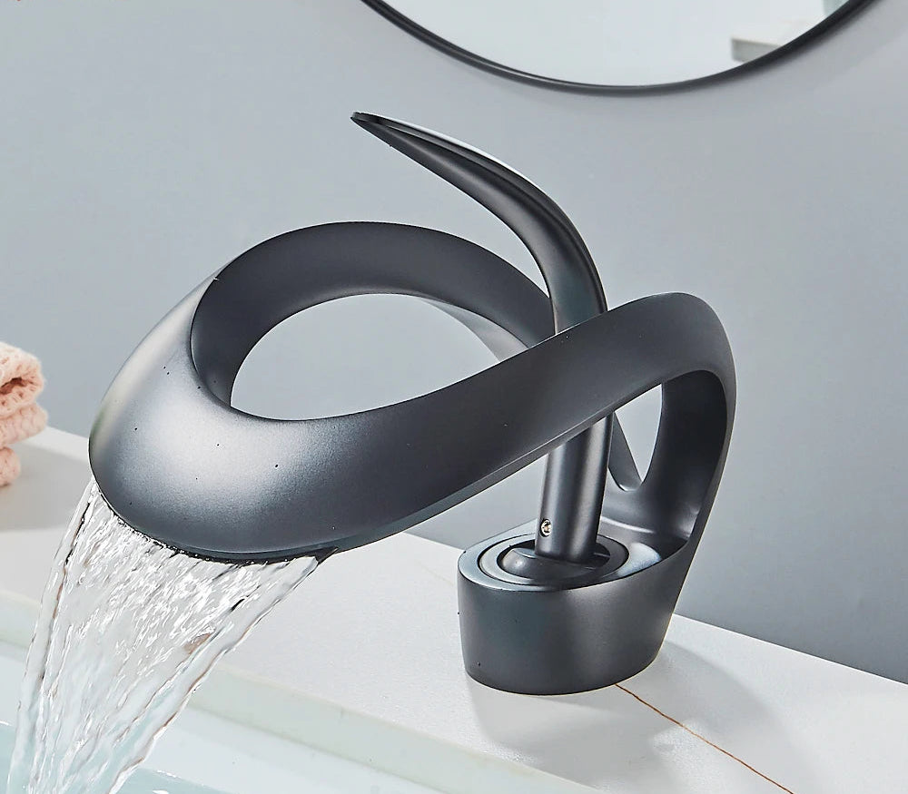 Solid brass waterfall basin faucet by MC THE BLACK DIAMOND with single handle for hot and cold water, designed for bathroom sinks.