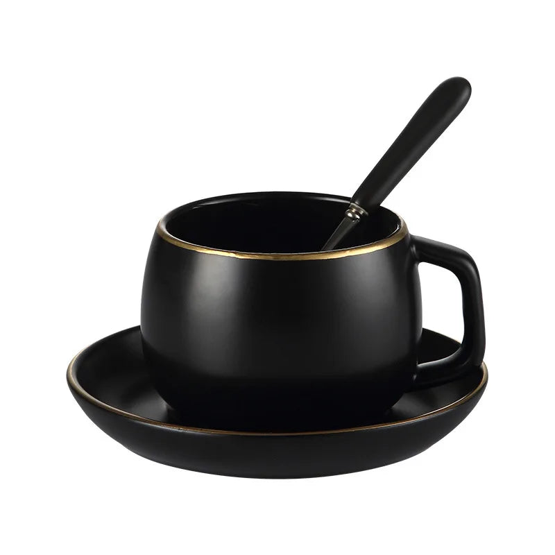 Creative matte black ceramic coffee cup with gold border and matching saucer, modern design for cafe or home use.
