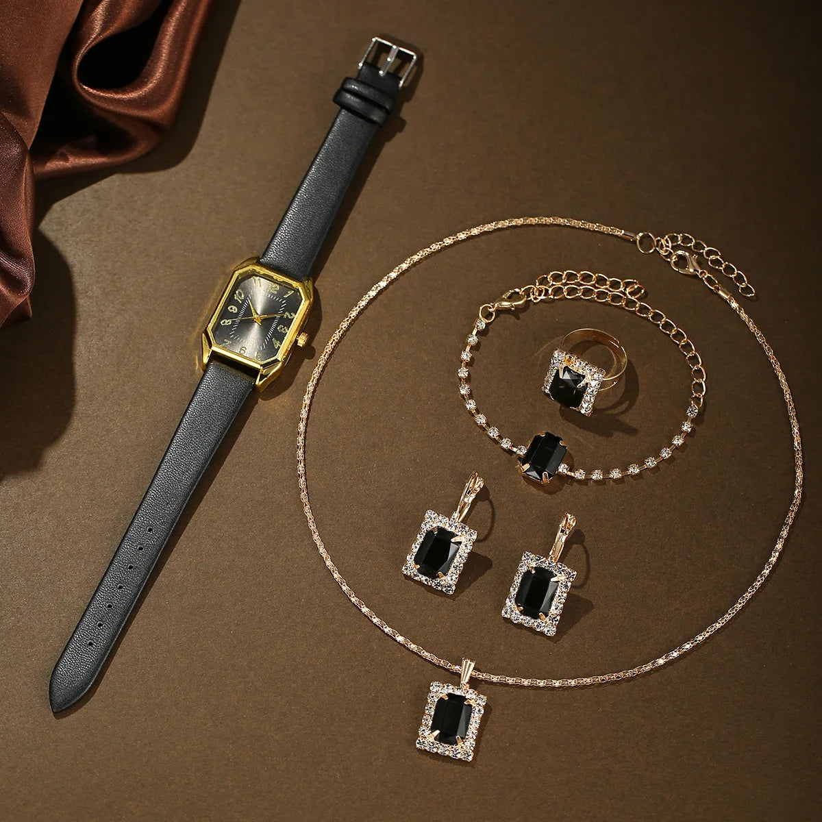 Luxury fashion square women's watch by Mohammad Collection featuring a sleek jewelry design, gold-tone case, and elegant black strap.
