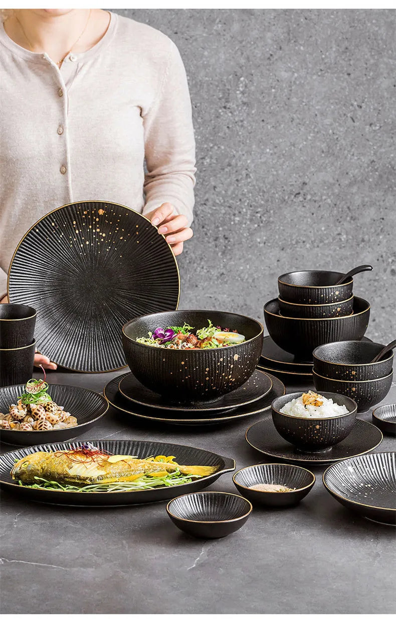 Black porcelain dinner plates with gilt rim, featuring a sleek design for serving rice, salads, noodles, and other meals in the kitchen.