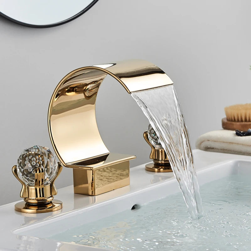 MC THE BLACK DIAMOND Shinesia luxury golden bathroom basin faucet with dual crystal handles, waterfall spout, hot and cold water mixer tap.
