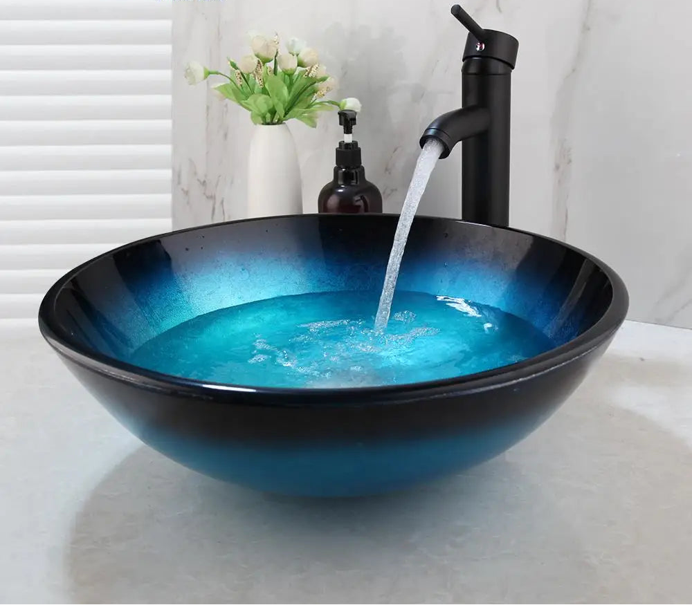 MC THE BLACK DIAMOND ZAPPO tempered glass bathroom vessel sink with waterfall black faucet, oval blue above-counter basin.