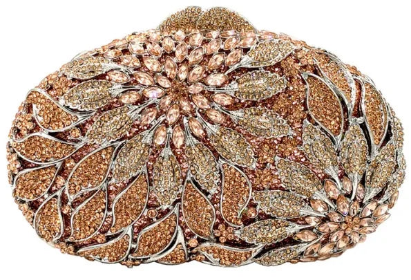 Gold metal leaves and white crystal evening clutch bag by MC THE BLACK DIAMOND, featuring rhinestones and a mini heart design for women.