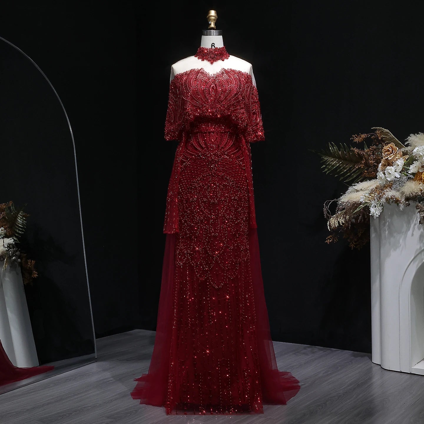 Elegant grey Arabic evening dress by MC THE BLACK DIAMOND, beaded details, flowing fabric, perfect for special occasions