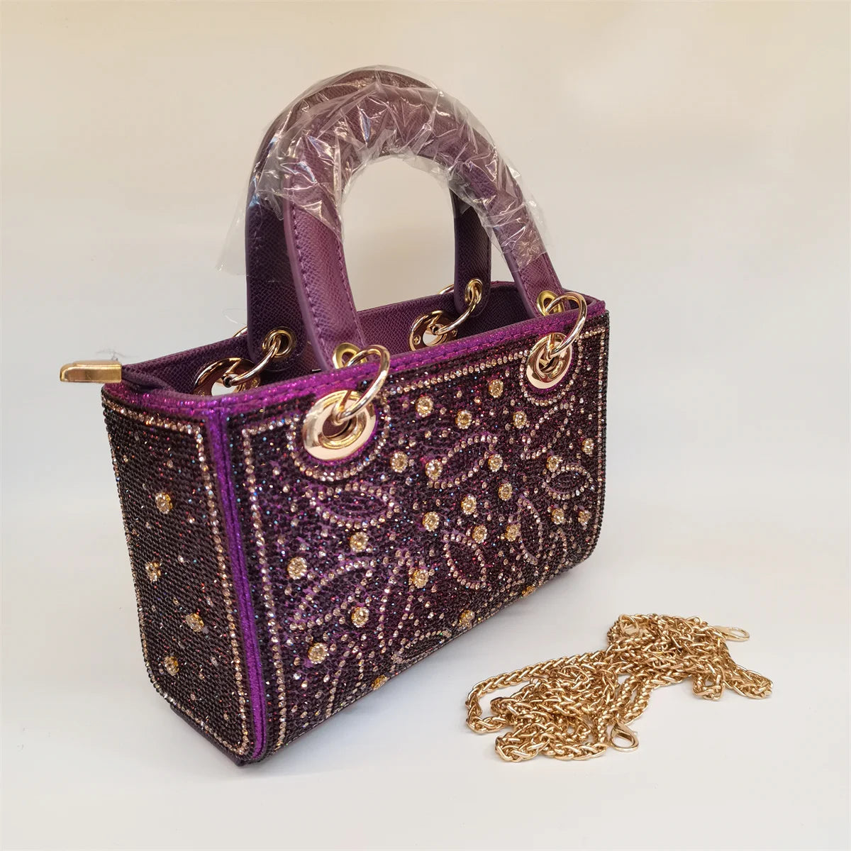 MC THE BLACK DIAMOND rhinestone evening handbag featuring a long chain, embellished clutch style, ideal for casual or formal events.