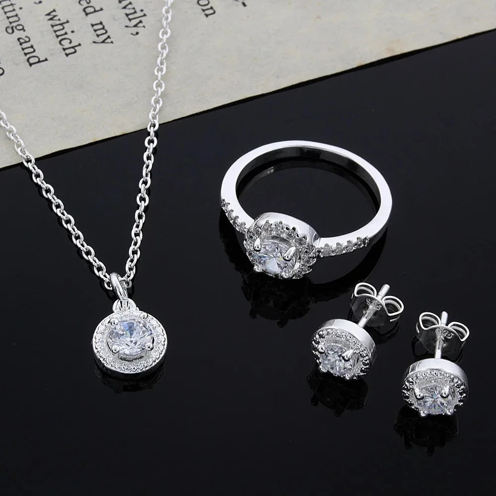 Silver jewelry set with zircon crystals including necklace, ring, and earrings from 𝕄𝕔 𝕋𝕙𝕖 𝔹𝕝𝕒𝕔𝕜 𝔻𝕚𝕒𝕞