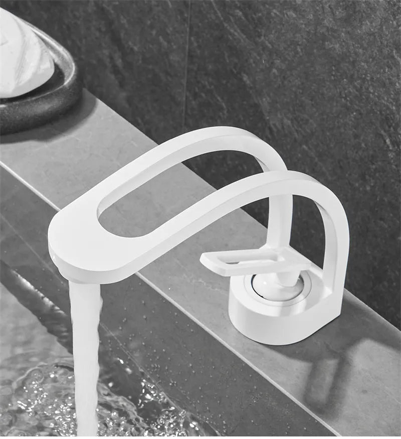 Black, grey, white, and gold bathroom mixer tap by MC THE BLACK DIAMOND, designed for wash basins and baths.