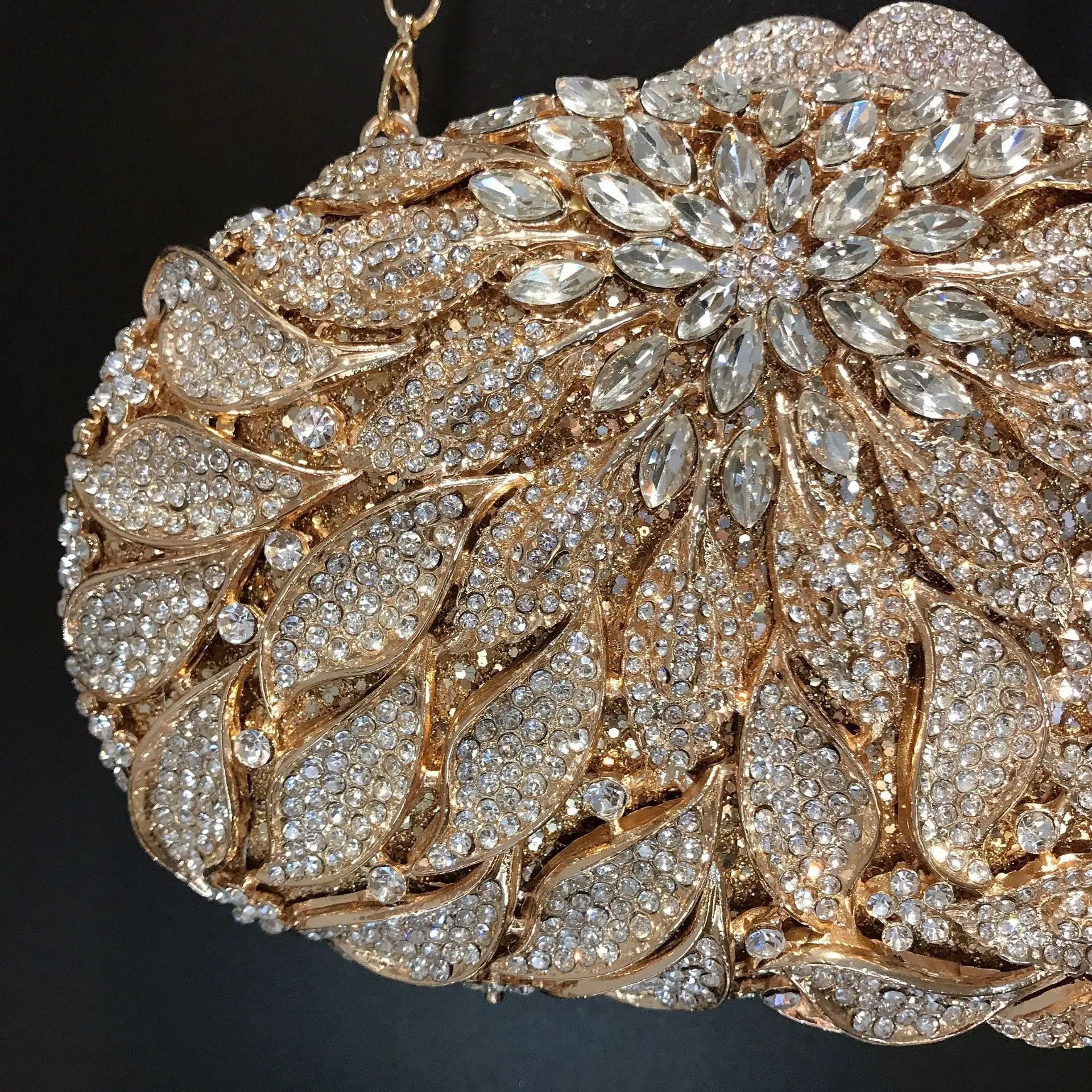 Gold metal leaves and white crystal evening clutch bag by MC THE BLACK DIAMOND, featuring a mini heart shape for women’s wedding or party.