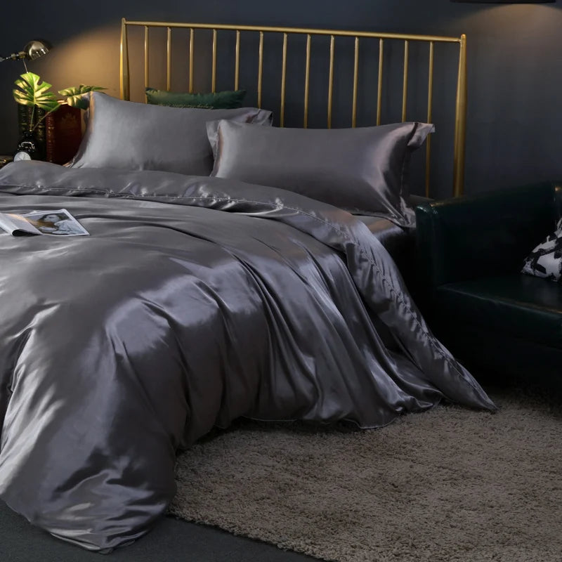 Luxury silk bedding set with duvet cover, fitted sheet, flat sheet, and pillowcases in solid color, King and Queen sizes.