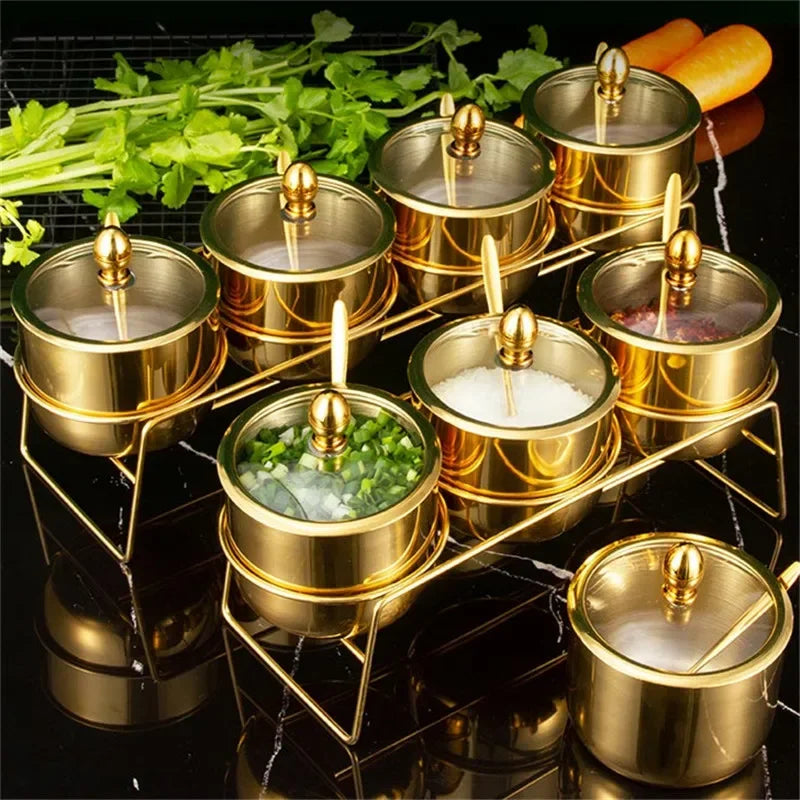Gold MC THE BLACK DIAMOND 304 seasoning box with glass cap, spoon, and spice jar for salt, sauce, and soy sauce storage in kitchen.