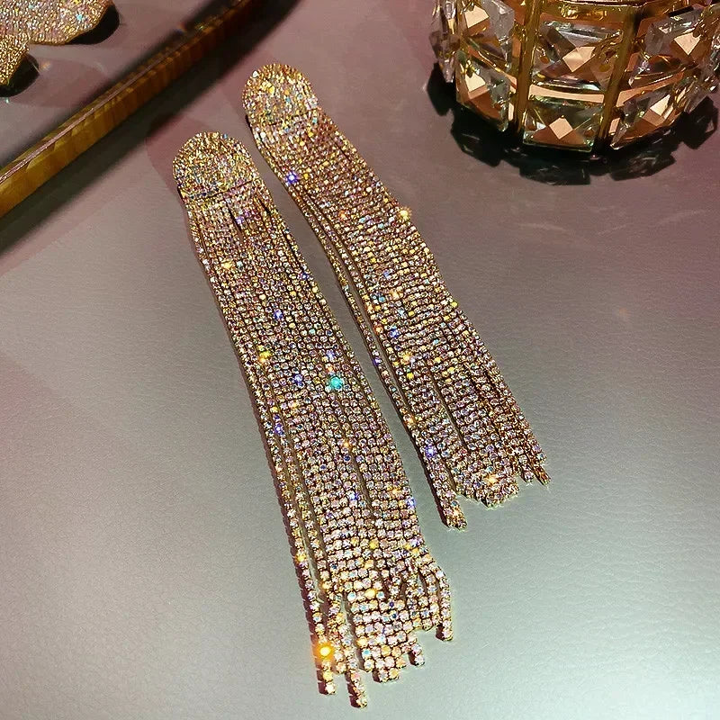 MC THE BLACK DIAMOND long tassel rhinestone drop earrings for women featuring oversized crystal dangles and fashionable jewelry accessories.
