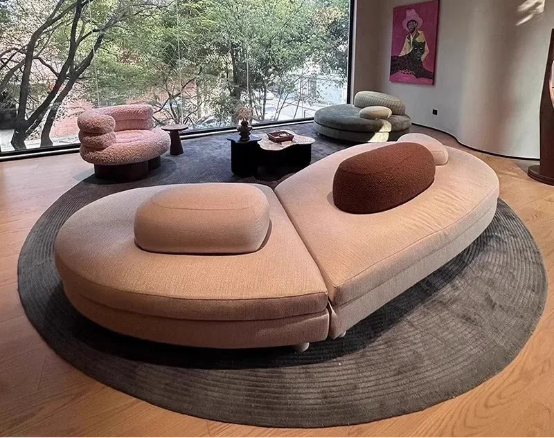 Large green fabric sectional sofa from MC THE BLACK DIAMOND, featuring a French pebble design and modular love seat with special-shaped arc.