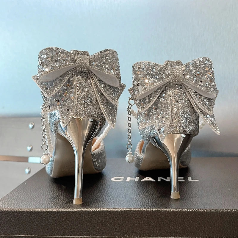 Elegant Mohamad Collection French pointy high heels with sequined bow, pearl line, and shallow mouth, showcasing fine heel craftsmanship.