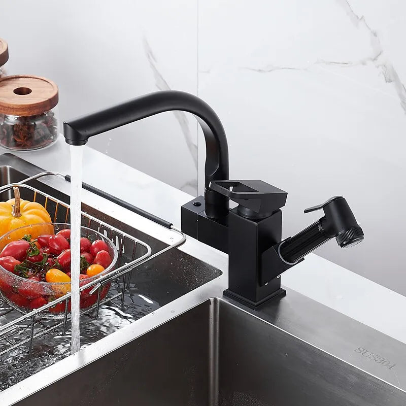 Black deck-mounted kitchen sink faucet with flexible pull-out spout, hot and cold water controls, chrome finish, by MC THE BLACK DIAMOND