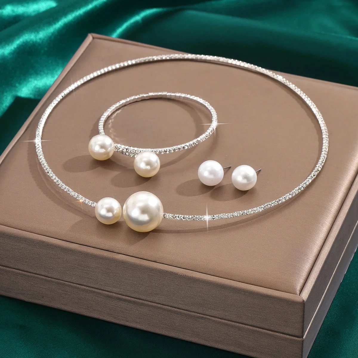 Mohammad Collection full crystal jewelry set with pearl necklace, bracelet, and earrings featuring minimalist design.