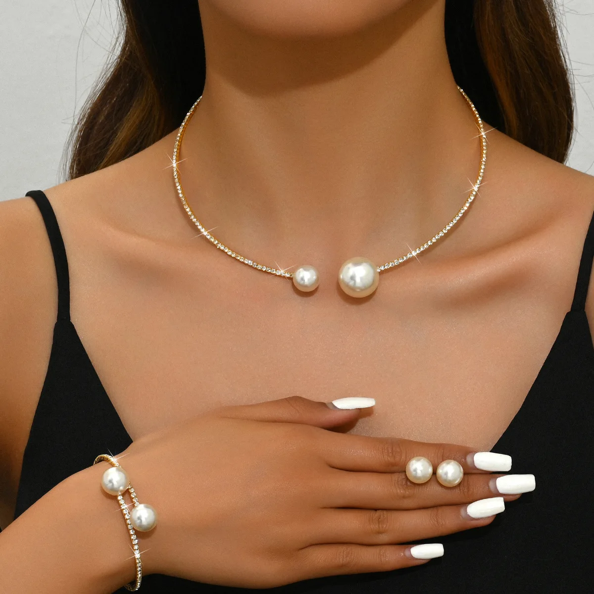 Mohammad Collection trendy full crystal jewelry set with minimalist pearl necklace, bracelet, and earrings on a white background.