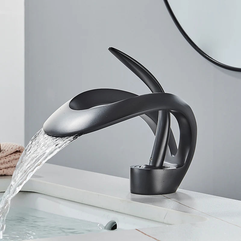 Solid brass waterfall basin faucet by MC THE BLACK DIAMOND with single handle for hot and cold water, designed for bathroom sinks.