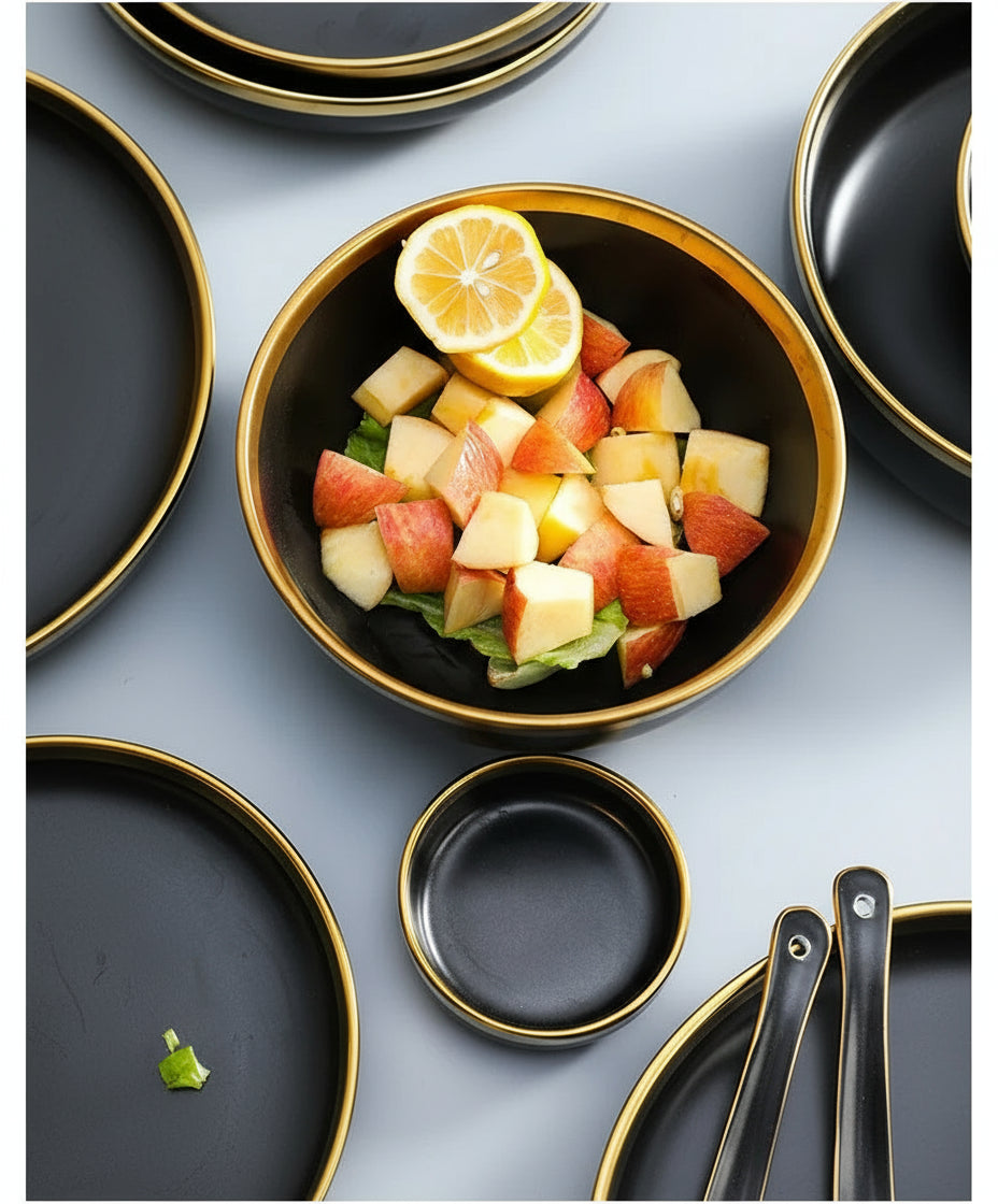 Set of matte gold inlay black porcelain dinnerware by MC THE BLACK DIAMOND, includes plates and bowls for elegant kitchen use.