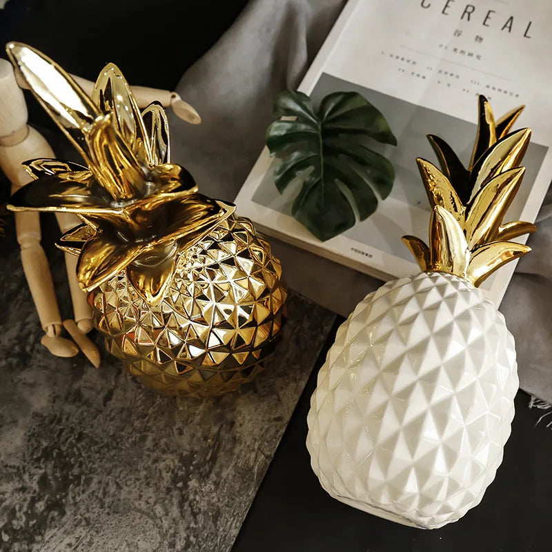 Golden ceramic pineapple decor by MC THE BLACK DIAMOND, perfect as a stylish home or wedding gift, ideal for living room or porch.