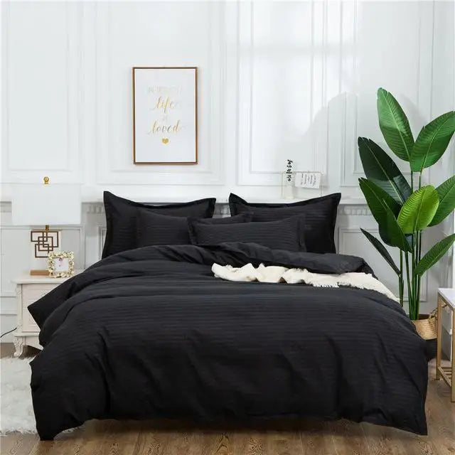 Black quilt set by MC THE BLACK DIAMOND featuring a double queen king size bedding comforter duvet cover on a bed.