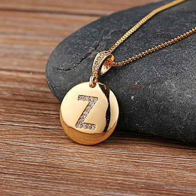Copper initial letter necklace featuring a CZ charm from 𝕄𝕔 𝕋𝕙𝕖 𝔹𝕝𝕒𝕔𝕜 𝔻𝕚𝕒𝕞𝕠�