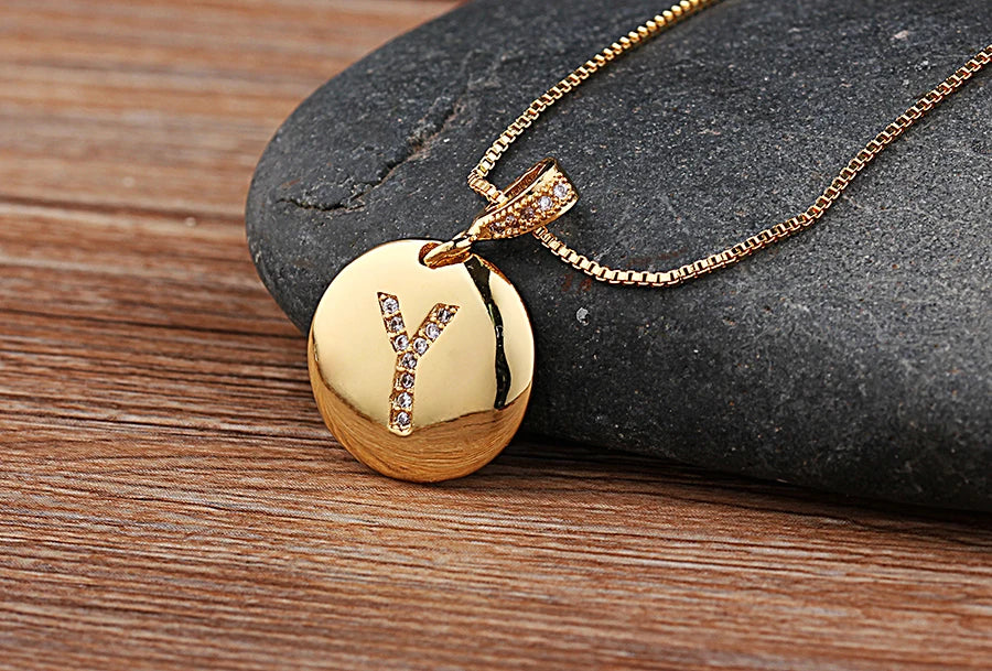Nidin gold-tone initial letter necklace featuring the letter A with CZ accents, jewelry piece from 𝕄𝕔 𝕋𝕙𝕖 𝔹𝕝𝕒𝕔𝕜 𝔻𝕚�