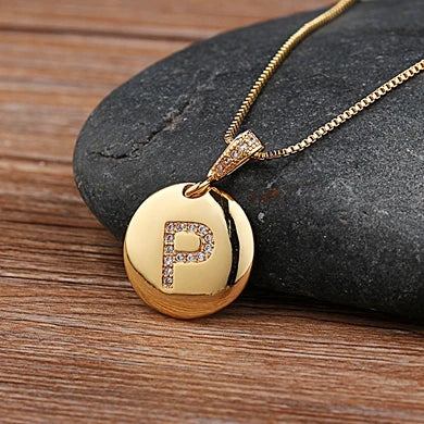 Nidin initial letter necklace featuring a copper charm with CZ stones, personalized gift jewelry by 𝕄𝕔 𝕋𝕙𝕖 𝔹𝕝𝕒𝕔𝕜 𝔻𝕚𝕒